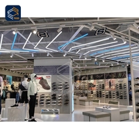 Système de présentation modulaire verrouillable pour magasins de détail, équipement de pose pour présentoirs de vêtements