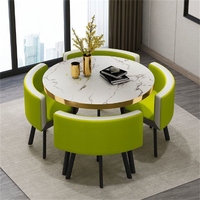 Ensemble de table à manger ronde moderne, luxueuse, durable, imperméable et écologique avec chaises en métal pour une utilisation en extérieur dans les hôtels, 1 table et 4 chaises