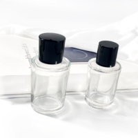 Bouteilles en verre rondes uniques en forme de cylindre 50ml 75ml conteneur cosmétique atomiseur bouteille d'huile d'olive bouteille de parfum en verre