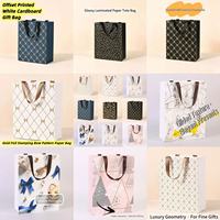 Sac en papier promotionnel écologique en carton blanc robuste avec logo personnalisé, estampage UV doré, design artisanal durable