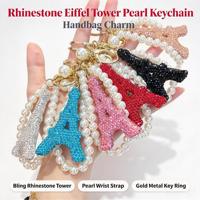 Élégant porte-clés tour Eiffel avec strass et fausse perle, accessoire tendance pour sac à main, pendentif pour femme