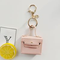 Mini porte-clés en cuir |   Porte-cartes et porte-monnaie de couleur unie avec breloques |   Logo personnalisable