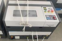 Petite machine de gravure laser CO2 3020 40W/50W refroidie à l'eau CNC pour usage domestique, bois et panneaux colorés