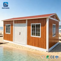 Maison conteneur modulaire durable sur mesure de 20 pieds avec toit plat incliné et fonction de panneau d'activités imperméable