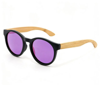 Style durable : Lunettes de soleil noires à monture ronde avec branches en bois véritable et verres polarisés UV400
