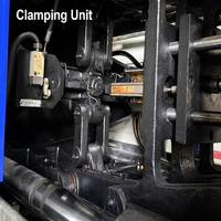 Machine de moulage par injection d'occasion de 650 tonnes pour la fabrication de grandes chaises en plastique, caisses, pare-chocs et seaux – Haute performance