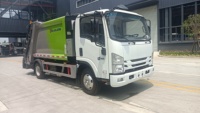 Camion à ordures Isuzu 4x2 manuel personnalisé pour l'exportation, 7 m³ de capacité, compacteur de déchets à chargement arrière de haute qualité, haute efficacité