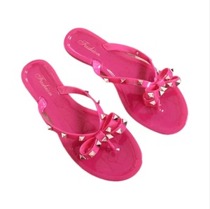 E0551 Sandalias Planas de Playa para Mujer, Estilo Nuevo, con Remaches y Lazo, Transpirables, Impermeables, de Gelatina Transparente - Product Image 1