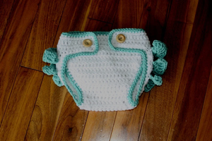 ผ้ากันเปื้อนเด็กถักมือ แต่งระบายลายอมยิ้ม สีขาวชมพู โบว์น่ารัก ของขวัญสำหรับเด็กอ่อน - Product Image 1