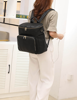 Sac à couches de luxe à la mode sac à dos personnalisé imperméable en cuir végétalien sac à couches pour bébé avec station à langer