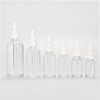 Flacon compte-gouttes cylindrique en verre avec boîte, pipette en caoutchouc noir pour l'emballage d'huiles essentielles et de sérums, personnalisation OEM