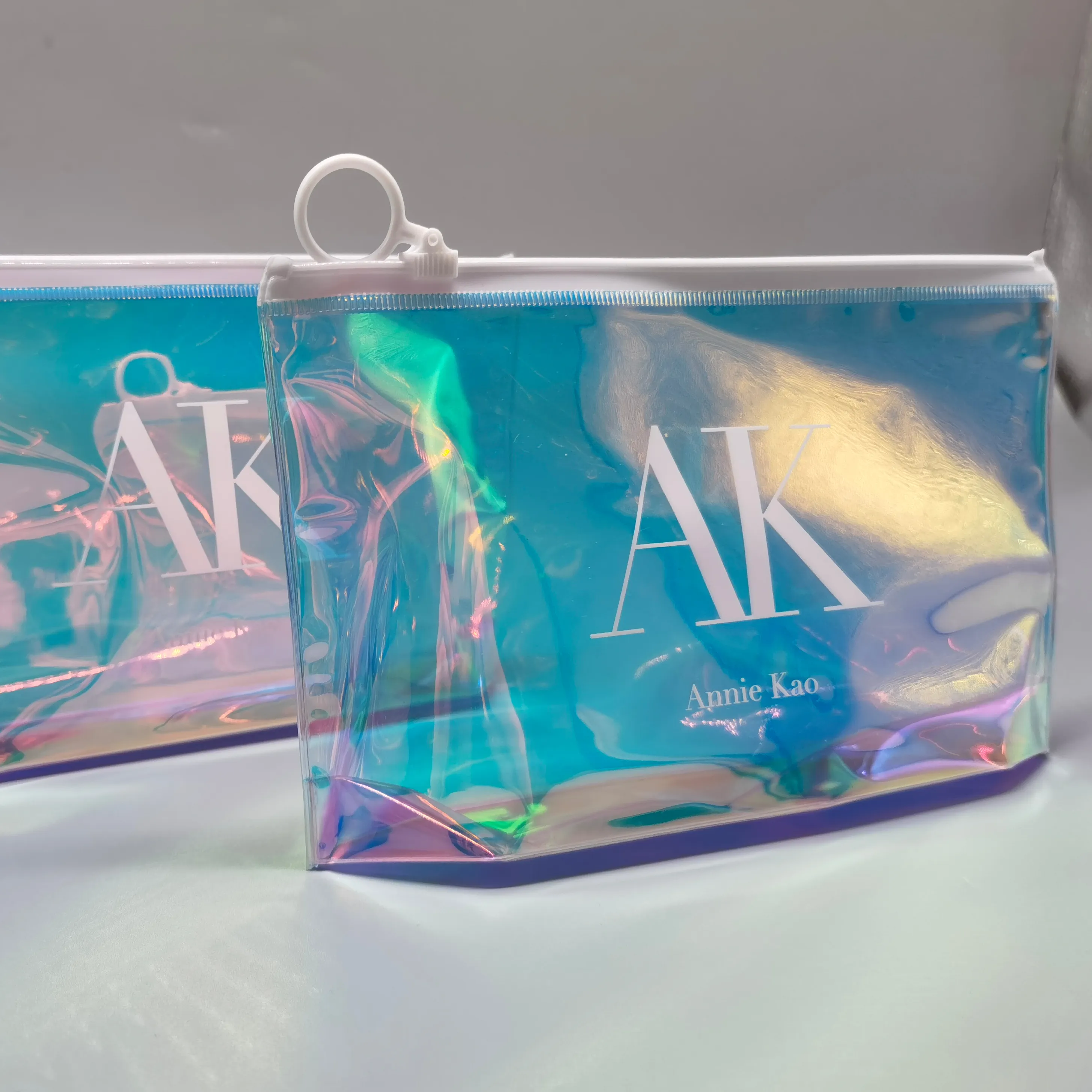 Bolsa de cosméticos holográfica personalizada, embalaje de ropa de PVC, bolsa de plástico con cierre
