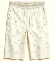Short de plage mi-mollet pour femme à imprimé tropical, taille élastique jacquard avec cordon de serrage, coupe ample et légère, idéal pour les vacances à la station balnéaire