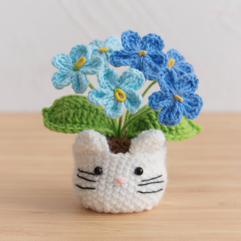 6 unidades de maceta con forma de gato y diseño de nomeolvides en degradado azul.