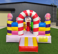 Structure gonflable personnalisée en forme de bonbon pour enfants, idéale pour les événements extérieurs, les parcs d'attractions et les locations commerciales.