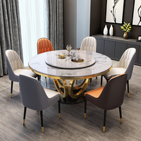 Table à manger ronde de luxe au design italien, plateau en pierre frittée, base sculpturale dorée pour mobilier de salle à manger moderne