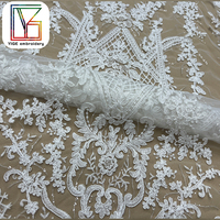Nouvelle Arrivée Tissu en Dentelle Française Tissu Brodé de Paillettes Tissu en Dentelle Guipure Tissu en Dentelle Cordonnée Tissu en Maille pour Robes de Mariée Blanches