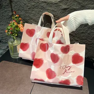 Bolsa de plástico con asa de bucle suave para embalaje de ropa de polietileno personalizada con impresión de logotipo para tienda