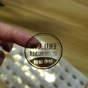 Customized Printing Hot Stamping Foil Clear Gold Stickers Waterproof Self Adhesive Plastic Transparent Logo Label