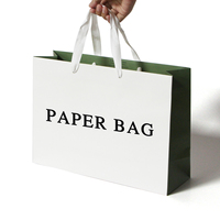 Sacs cadeaux en papier blanc de luxe avec logo personnalisé, recyclables, avec poignées en ruban, pour l'emballage de vêtements et de chaussures, vente en gros