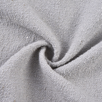 Tissu tissé en tweed lurex, idéal pour les gilets raffinés, les robes structurées et les costumes.