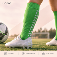 Chaussettes de football renforcées pour équipes de jeunes, vert vif, à profil fin, pour une adhérence sécurisée sur terrain, avec base de crampons et conception graduée pour la taille