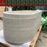 Baignoire autoportante ovale en travertin beige clair GOLDKING, rainures verticales cannelées, personnalisable OEM
