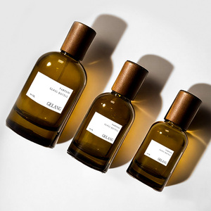Nuovo Design Bottiglie di <span class=keywords><strong>Profumo</strong></span> Personalizzate in Vetro Ambrato da 30ML e 50ML, Flacone Rotondo con Tappo in Legno ed Etichetta - Product Image 1