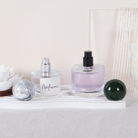 Flacon de parfum en verre de luxe en forme de cylindre vide de 30ml 50ml 100ml avec couvercle à boule