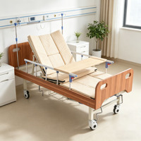 Lit médical manuel semi-courbé à cadre renforcé, avec matelas anti-escarres sur mesure, barrières latérales et support de perfusion pour la réadaptation