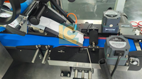 Machine d'étiquetage pour petites canettes rondes en aluminium, avec application d'étiquettes sur les côtés, le dessus et le bas