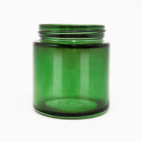 Les conteneurs médicaux en verre de H63 3oz verdissent les pots en verre peints avec les couvercles noirs mats de CR portatifs à prendre pour des pilules ou des onguents