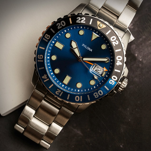 La montre-bracelet pour homme en quartz possède une fenêtre <span class=keywords><strong>loupe</strong></span> pour l'affichage de la date sur le <span class=keywords><strong>lunette</strong></span> rotative en acier inoxydable - Product Image 1