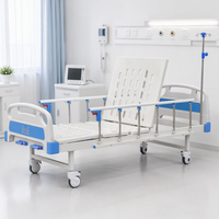 Lit médical manuel avec poteau porte-perfusion, dossier réglable par manivelle, plateau perforé pour soins palliatifs