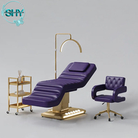 Lit de massage cosmétique électrique pour cils Table de massage spa de luxe Lit pour salon de beauté Mobilier d'esthéticienne Base dorée Lit incurvé pour le visage