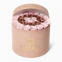 Vente en gros de boîte cadeau d'emballage de fleur rigide noire en papier de carton rond de luxe personnalisé avec ruban