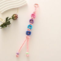 Nouveau style minimaliste, polyvalent, tendance, créatif, porte-clés en polyester tressé à la main avec nœud lettre, mode, passe-partout pour téléphone portable