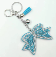 Koningsblauwe modieuze strikvormige sleutelhanger met volledig bezette strass steentjes en kwastjes, hoogwaardig, best verkochte charme hangende ornament