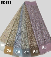 Tissu en dentelle de tulle lourdement perlé avec strass, 100 % polyester, broderie florale pour robe de mariée africaine ou de soirée