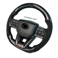 Volant en cuir perforé noir en fibre de carbone pour Toyota LC300 Cruise GR Volant de voiture Sport LED Style Factory Direct