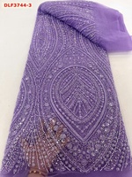 Tissu de dentelle de mariée en maille de tulle de broderie française perlée de haute qualité avec des paillettes pour des robes de mariée