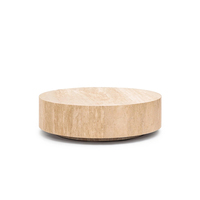 Table basse en travertin naturel crème, très demandée, de forme tambour large et plate, en pierre monobloc, socle moderne pour salon