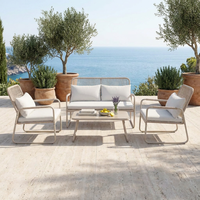 Ensemble de salon de jardin en rotin 4 pièces avec structure en acier thermolaqué et assise en osier tressé pour l'extérieur