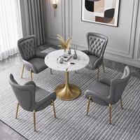 Ensemble de tables et chaises de café de luxe en cuir PU doré avec cadre en acier inoxydable et plateau en marbre artificiel, 2-3 chaises, style moderne minimaliste