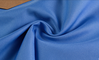 Tissu d'uniforme en gabardine 100% polyester bleu paon avec une bonne résistance de la couleur, utilisé pour les tabliers, les vêtements de travail, les uniformes scolaires