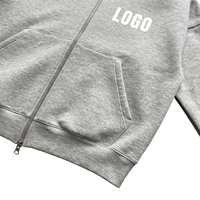 Vente en gros de sweats à capuche Essentials pour hommes, vierges, personnalisables avec logo, en coton épais 400 GSM gris chiné, coupe ample et tombante, avec fermeture éclair bidirectionnelle