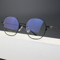 Montura de gafas ópticas redondas de titanio unisex, monturas de gafas graduadas ligeras a la moda