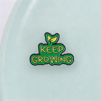 Broche émaillée avec citation inspirante et slogan 'Keep Growing' avec élément feuille de germe, pour revers et accessoire de sac à dos