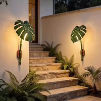 Lampe murale LED en fer forgé avec feuille de Monstera artificielle pour l'extérieur - Lumière chaude décorative pour villas, jardins, éclairage paysager