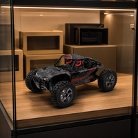 Buggy RC tout-terrain rouge avec pneus surdimensionnés, suspension à ressorts hélicoïdaux, télécommande 2,4 GHz, fonction 'Follow Me' pour enfants, chargeur expert inclus